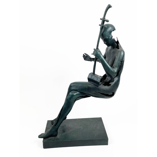 26 - ABSTRACT MUSICIAN SCULPTURE, in floating seated position  in verdigris finish, 87cm H.