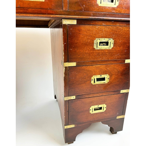 143 - PEDESTAL DESK, Campaign style mahogany with brass mounts and nine drawers, 75cm H x 122cm x 54cm.