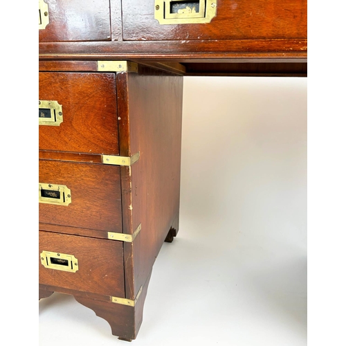 143 - PEDESTAL DESK, Campaign style mahogany with brass mounts and nine drawers, 75cm H x 122cm x 54cm.