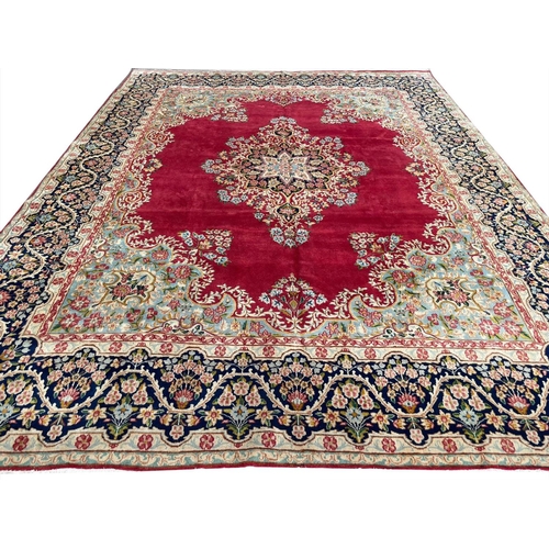 61 - FINE PERSIAN KIRMAN CARPET, 387cm x 295cm.