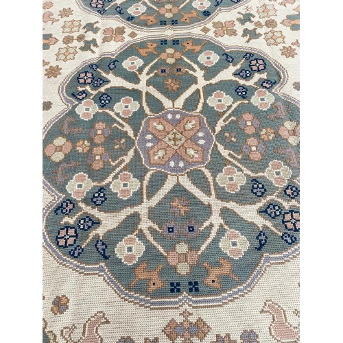 65 - PORTUGUESE CARPET, 290cm x 190cm.