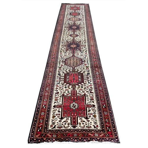 69 - PERSIAN KARAJA RUNNER, 345cm x 76cm.