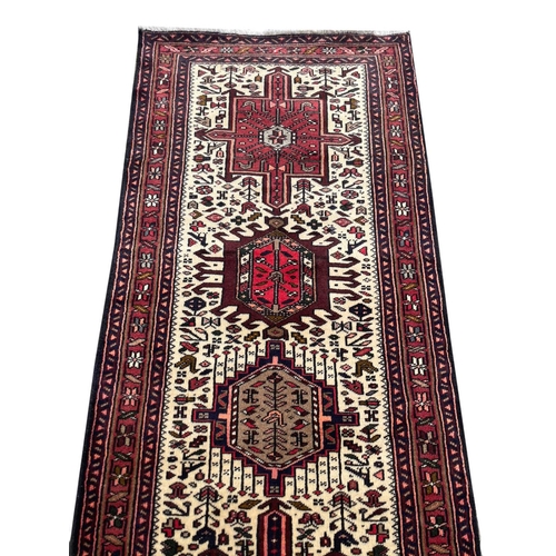 69 - PERSIAN KARAJA RUNNER, 345cm x 76cm.