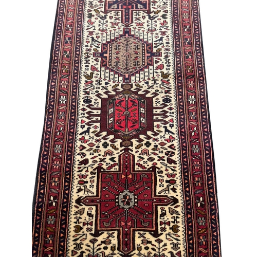 69 - PERSIAN KARAJA RUNNER, 345cm x 76cm.