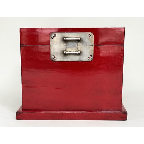 91 - TRUNK, early 20th century Chinese scarlet lacquer and silvered metal mounted with plinth and carryin... 