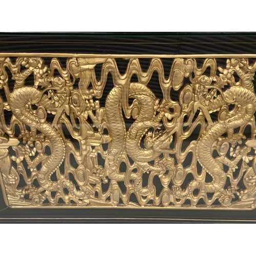 93 - LOW TABLE, Chinese lacquered and gilt, rectangular with carved dragon giltwood panel and glass, 64cm... 