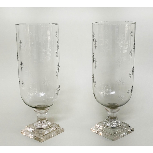 99 - STORM LANTERNS, a pair, cut glass of vase form engraved with stepped plinth base, 40cm H. (2)