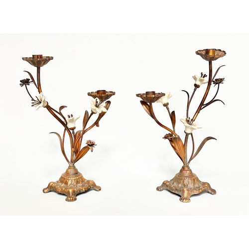 244 - FLOWER CANDLESTICKS, a pair, Italian style cast bronzed metal with ceramic flower heads, 40cm H. (2)