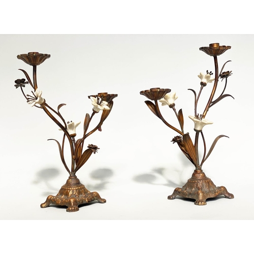 244 - FLOWER CANDLESTICKS, a pair, Italian style cast bronzed metal with ceramic flower heads, 40cm H. (2)