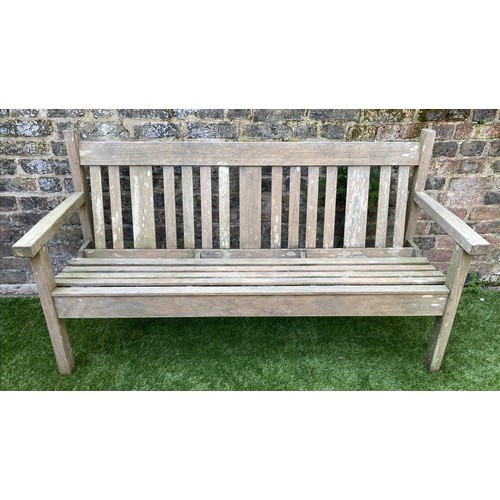 242 - GARDEN BENCH BY LISTER, 154cm W, weathered teak of slatted construction.