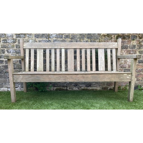 242 - GARDEN BENCH BY LISTER, 154cm W, weathered teak of slatted construction.