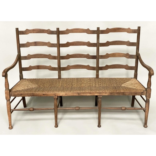 223 - HALL SEAT, early 20th century English oak with raised ladder back and rush seat, 157cm W.