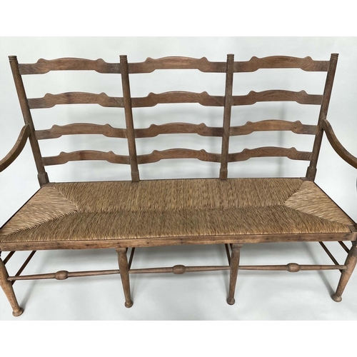 223 - HALL SEAT, early 20th century English oak with raised ladder back and rush seat, 157cm W.