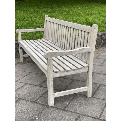 226 - GARDEN BENCH, silvery weathered teak of slatted and pegged construction, 180cm W.