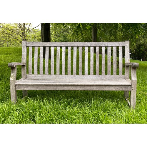 239 - GARDEN BENCH, weathered teak of slatted construction with shaped back and scroll arms, 152cm W.