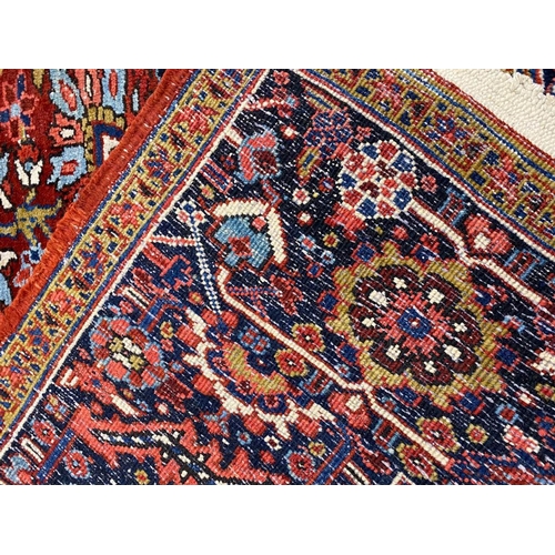 110 - ANTIQUE PERSIAN HERIZ CARPET, 380cm x 300cm.