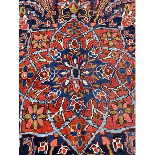 110 - ANTIQUE PERSIAN HERIZ CARPET, 380cm x 300cm.