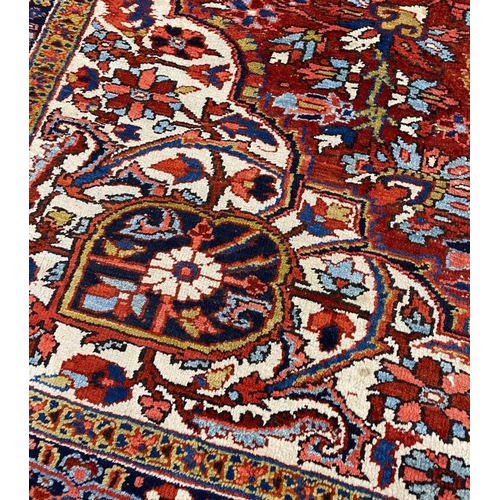 110 - ANTIQUE PERSIAN HERIZ CARPET, 380cm x 300cm.