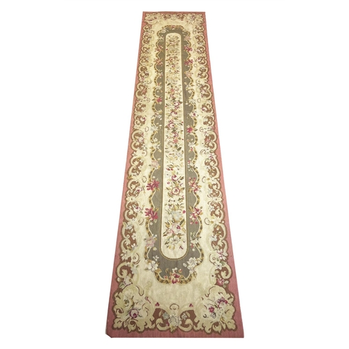 111 - AUBUSSON SAVONNERIE DESIGN NEEDLEPOINT RUNNER, 291cm x 65cm.