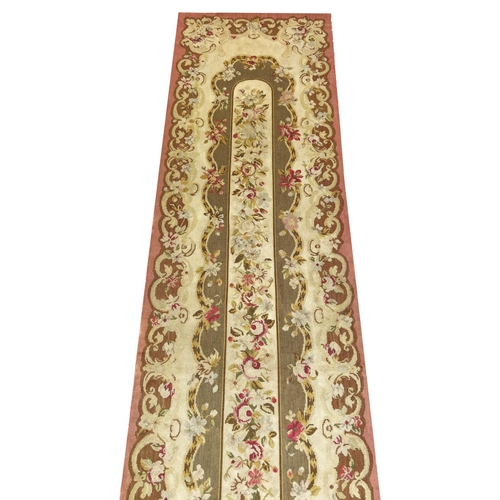 111 - AUBUSSON SAVONNERIE DESIGN NEEDLEPOINT RUNNER, 291cm x 65cm.