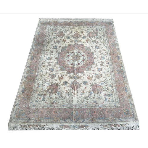 128 - TABRIZ PART SILK RUG, 216cm x 152cm, together qwith a matching circular rug, 155cm diam. (2)