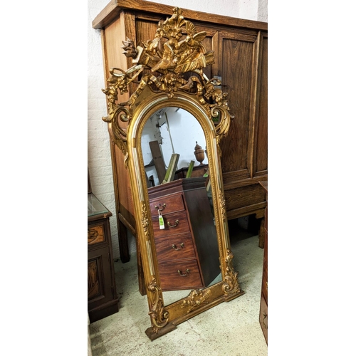 140 - WALL MIRROR, 95cm W x 194cm H mid 19th century Continental giltwood with torch and quiver, bird and ... 