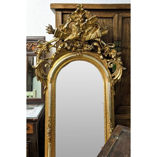 140 - WALL MIRROR, 95cm W x 194cm H mid 19th century Continental giltwood with torch and quiver, bird and ... 