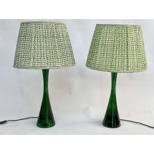 142 - TABLE LAMPS BY POOKY LIGHTING, a pair, green 'glass' of slim waisted form with green printed lamp sh... 