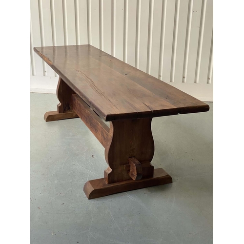 172 - YEWWOOD REFECTORY TABLE, 20th century Welsh solid yewwood with three plank top, twin trestles and st... 