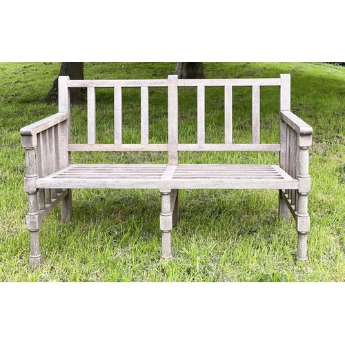 177 - GARDEN BENCH, weathered teak slatted with finely turned and stretchered front supports, 125cm W.