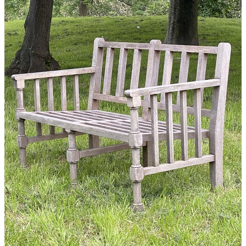 177 - GARDEN BENCH, weathered teak slatted with finely turned and stretchered front supports, 125cm W.