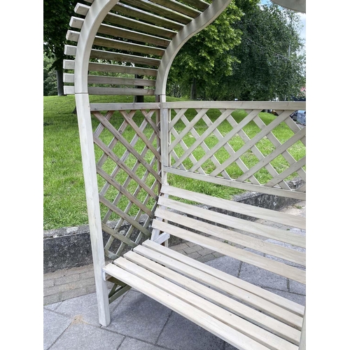 179 - GAZEBO, weathered arched slatted with lattice sides and back, 130cm W x 220cm H.