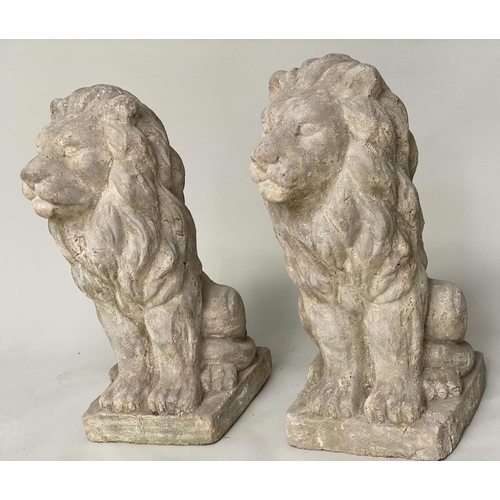 180 - GARDEN LIONS, a pair, well weathered reconstituted stone and terracotta seated, 75cm H. (2)