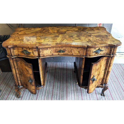 195 - DESK, 123cm W x 62cm D x 80cm H, early 20th century Italian olive wood with three drawers and two do... 