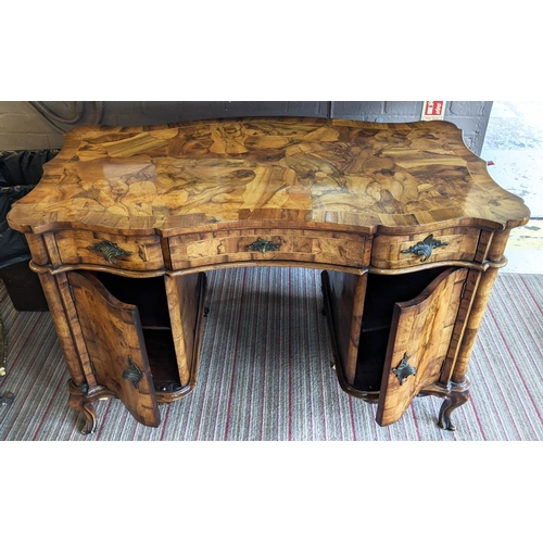 195 - DESK, 123cm W x 62cm D x 80cm H, early 20th century Italian olive wood with three drawers and two do... 