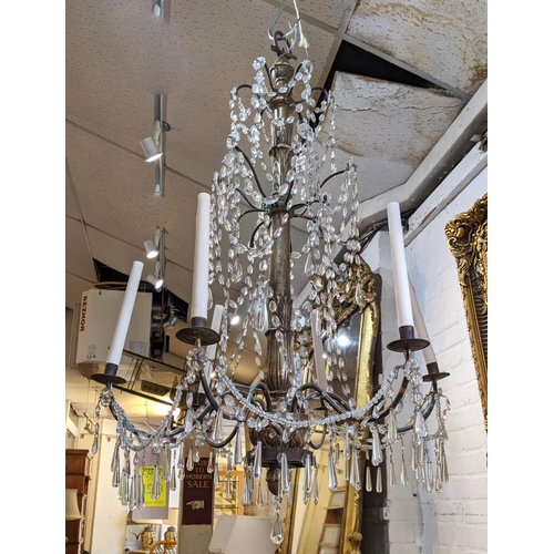 199 - CHANDELIERS, a pair, approx 115cm H x 80cm W, late 19th century, with a silvered wood stem, metal br... 