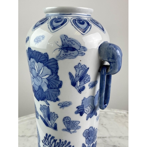 26 - CHINESE VASES, a pair, blue and white having butterflies, grapes and foliate decoration with elephan... 