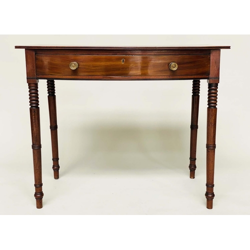 264 - WRITING TABLE, George III bowfronted mahogany with a full width frieze drawer and ring turned taperi... 