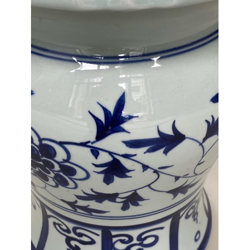 272 - CHINESE STOOLS, a pair, blue and white ceramic with dragon and leaf decoration, 40cm H x 33cm W. (2)