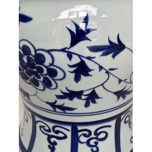 272 - CHINESE STOOLS, a pair, blue and white ceramic with dragon and leaf decoration, 40cm H x 33cm W. (2)