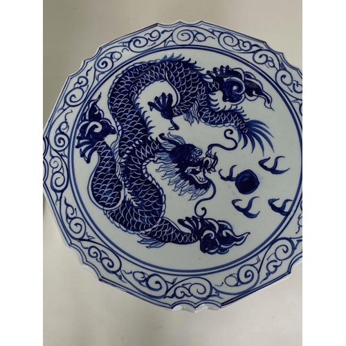 272 - CHINESE STOOLS, a pair, blue and white ceramic with dragon and leaf decoration, 40cm H x 33cm W. (2)