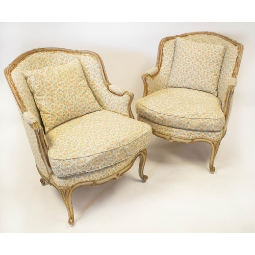 293 - BERGERES, 84cm H x 68cm W, a pair, early 20th century French painted and parcel gilt in floral uphol... 