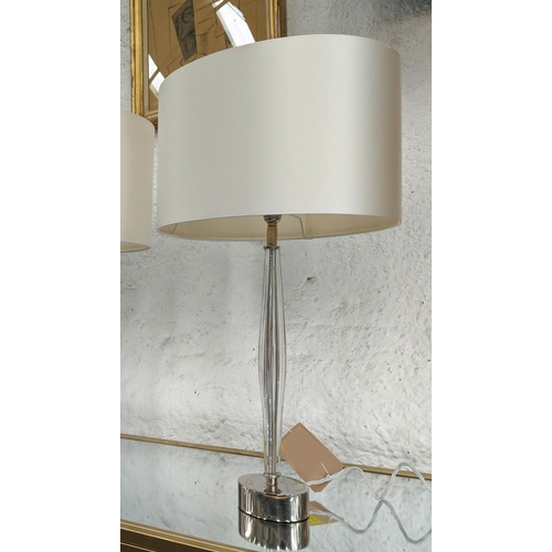 312 - TABLE LAMPS, a pair, 67cm H, Murano style slender glass with polished metal bases, with shades.