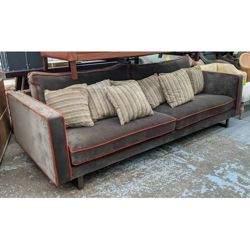 322 - LOVE YOUR HOME BYRON SOFA, 250cm x 109cm x 68cm, grey velvet upholstered with orange piping detail.