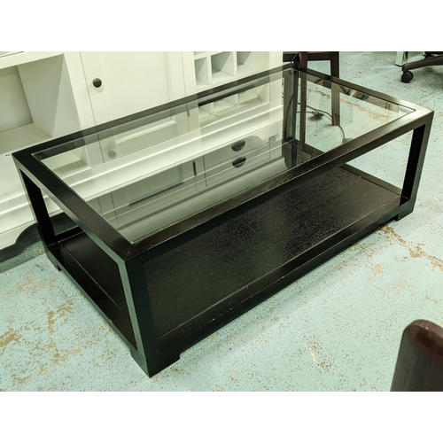 502 - LOW TABLE, ebonised with glass top, ebonised undertier, 120cm x 70cm x 42cm.