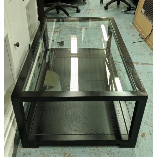 502 - LOW TABLE, ebonised with glass top, ebonised undertier, 120cm x 70cm x 42cm.