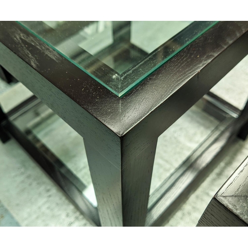 504 - SIDE TABLES, a pair, ebonised with two glass tiers, 46cm x 46cm x 46cm. (2)