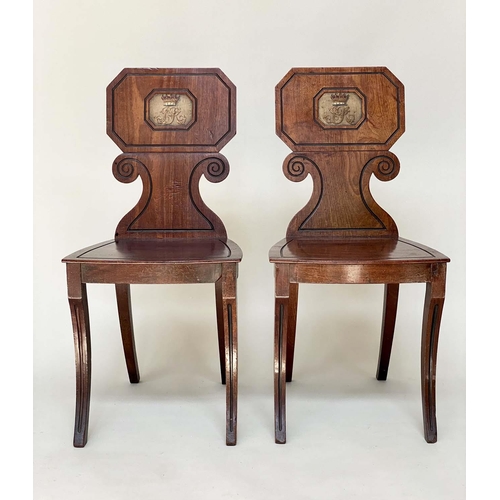 150 - HALL CHAIRS, a pair, George IV mahogany with scroll carved and incised backs and painted monograms b... 