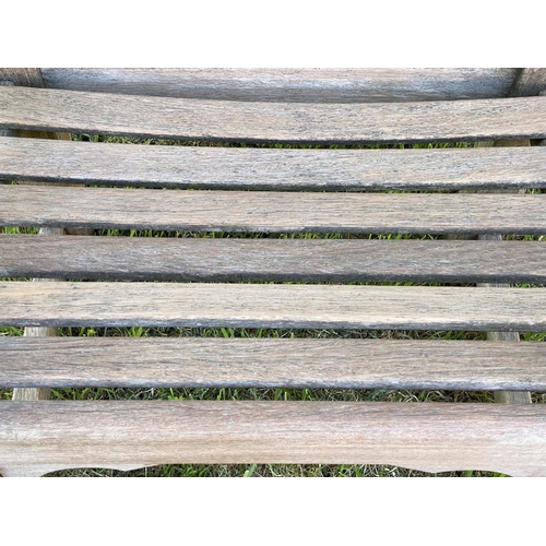 185 - GARDEN ARMCHAIRS, a pair, silvery weathered teak of substantial form, slatted and pegged constructio... 