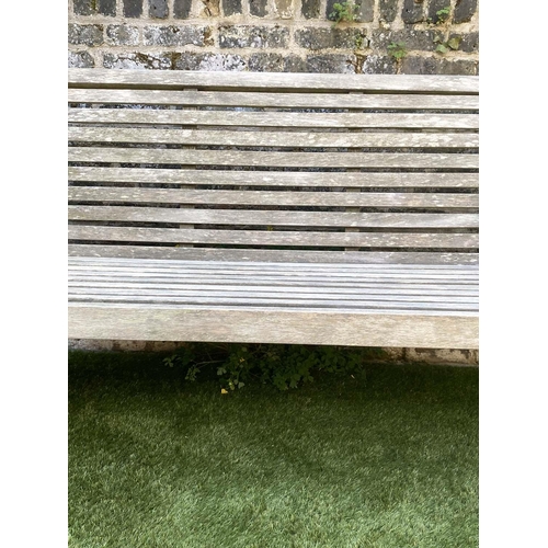 175 - GARDEN BENCH, weathered teak with horizontal slat back and seat and downswept arms by 'Trinity', 162... 